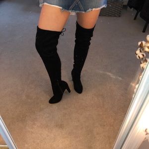 knee-high black heels.